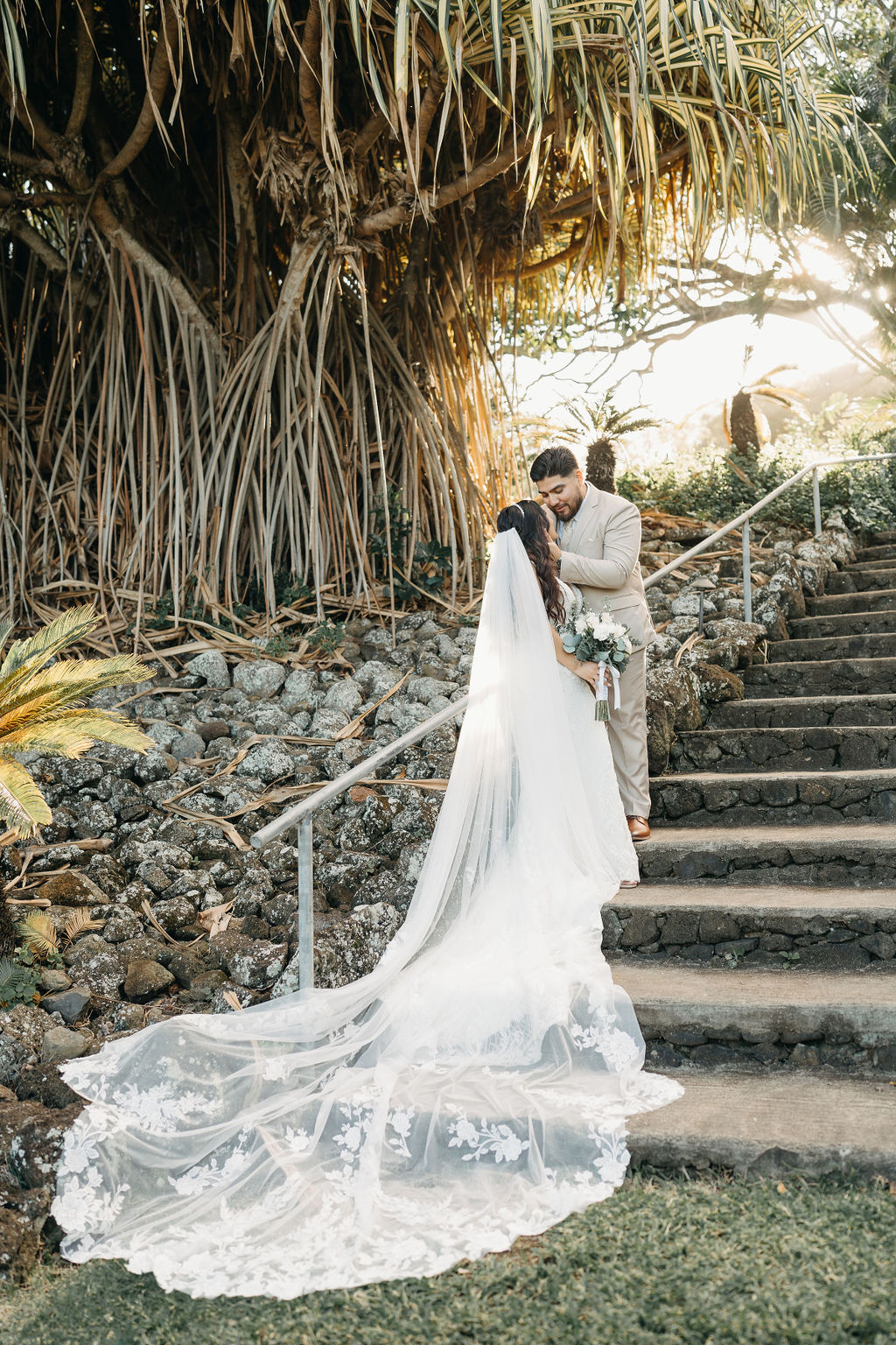 bride and groom take wedding portraits at kualoa ranch in oahu 