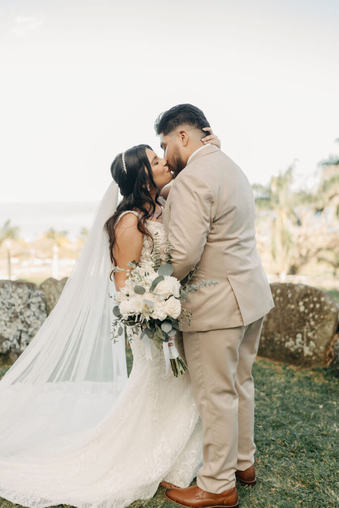 bride and groom take wedding portraits at kualoa ranch in oahu