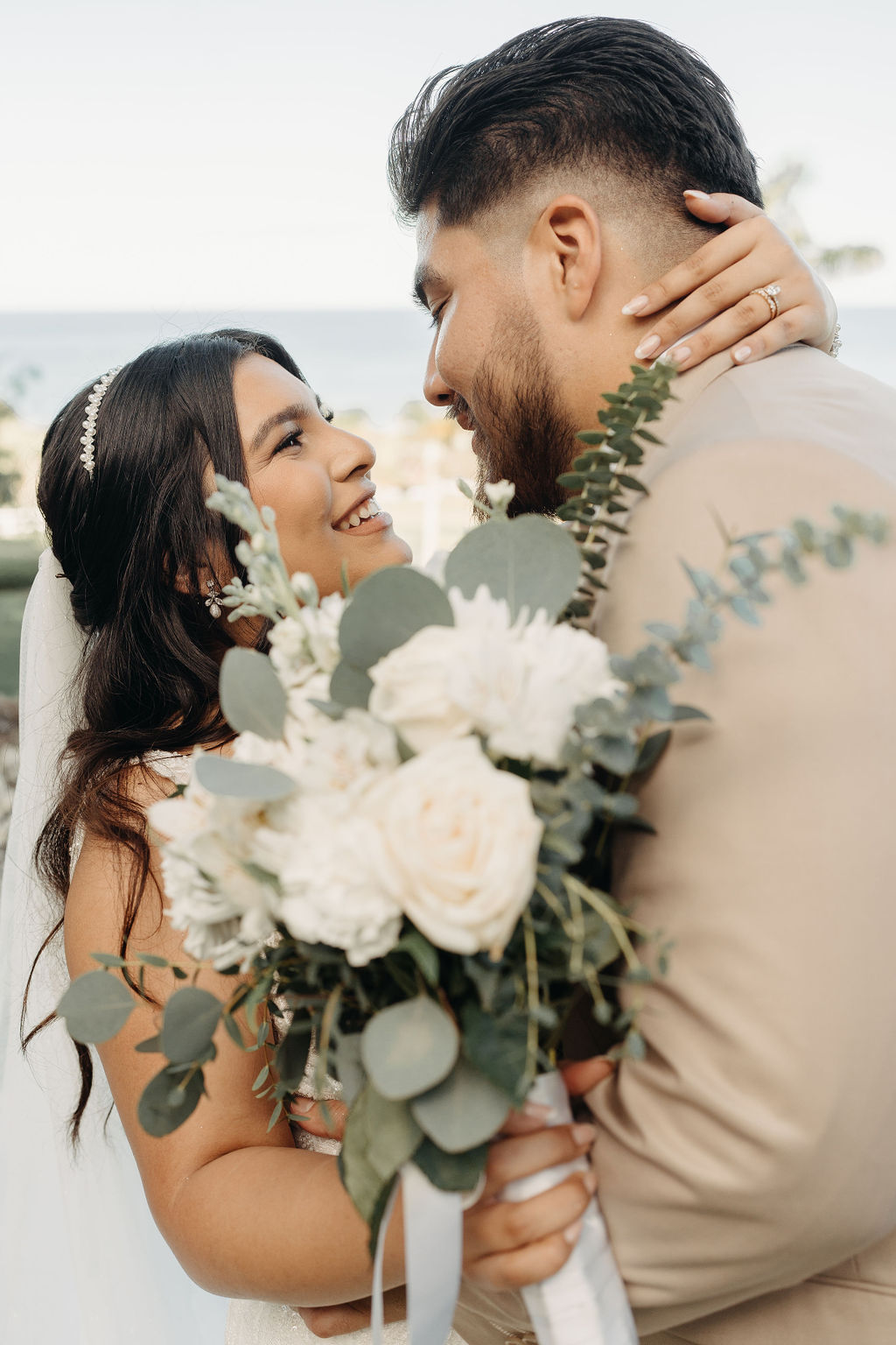 bride and groom take wedding portraits at kualoa ranch in oahu 