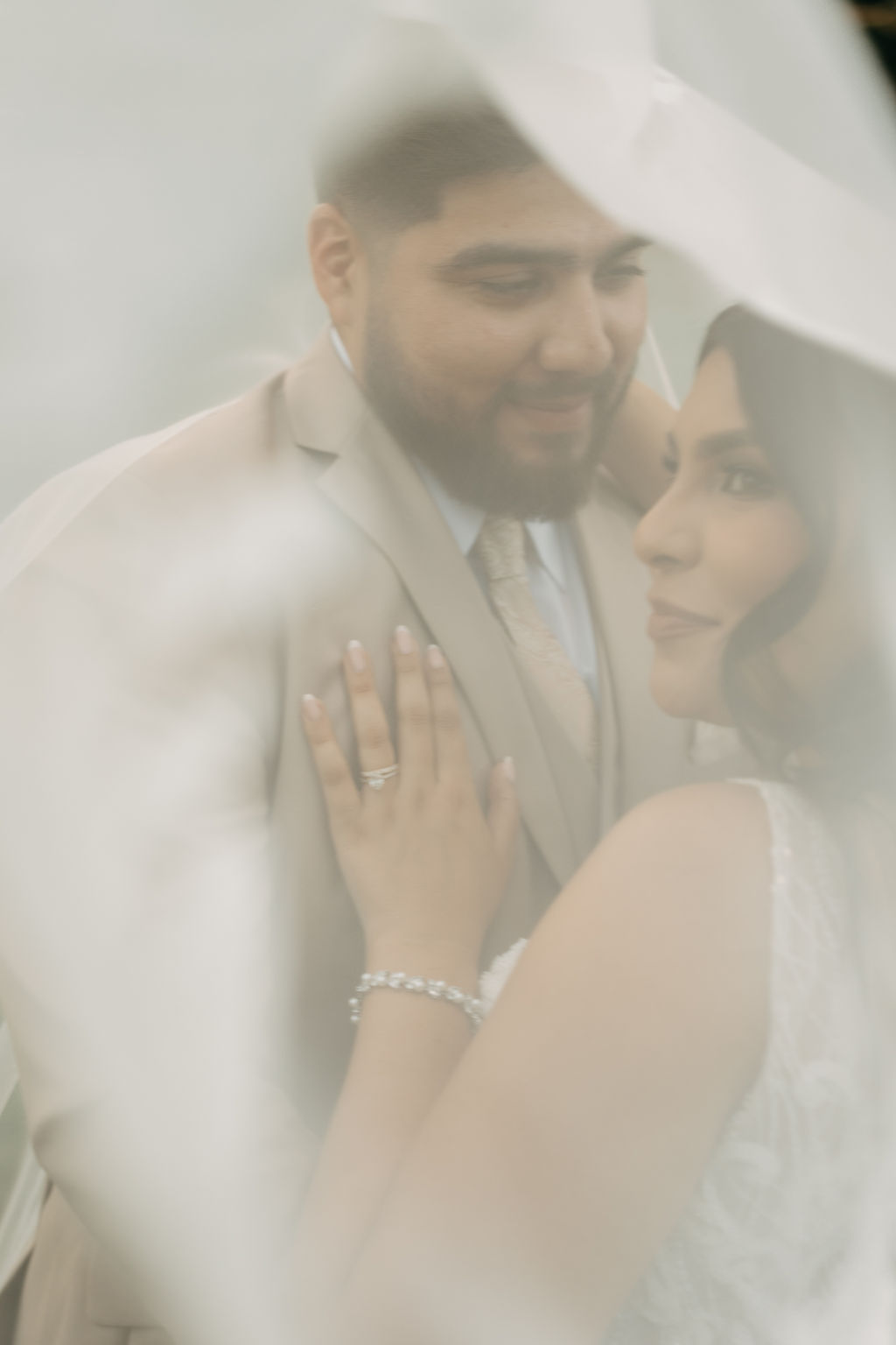 bride and groom take wedding portraits at kualoa ranch in oahu