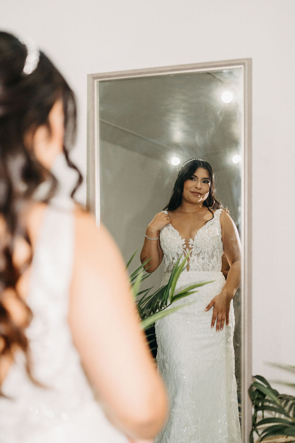 bride getting ready in her suite for her wedding in oahu