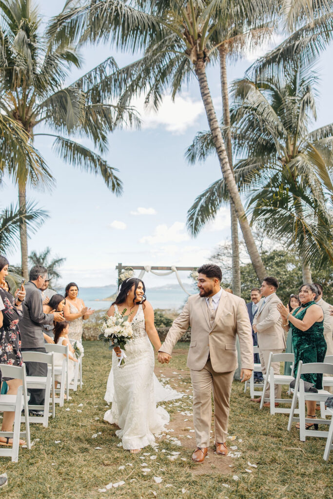 bride and groom at their wedding ceremony at kualoa ranch