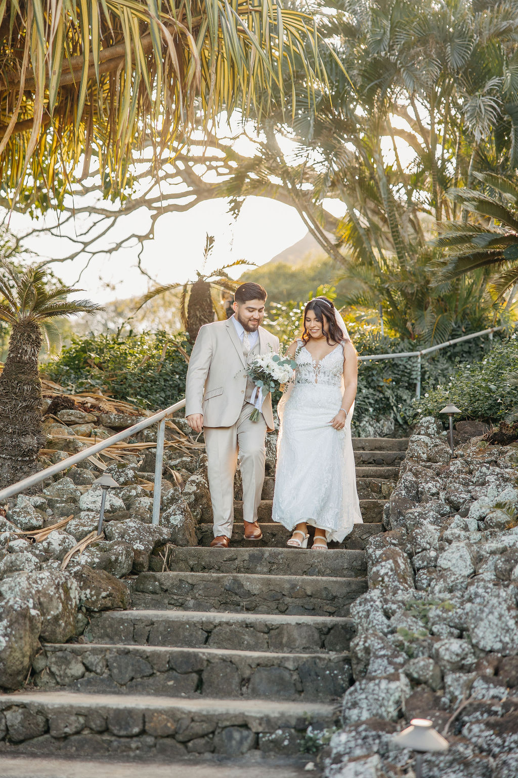 bride and groom take wedding portraits at kualoa ranch in oahu