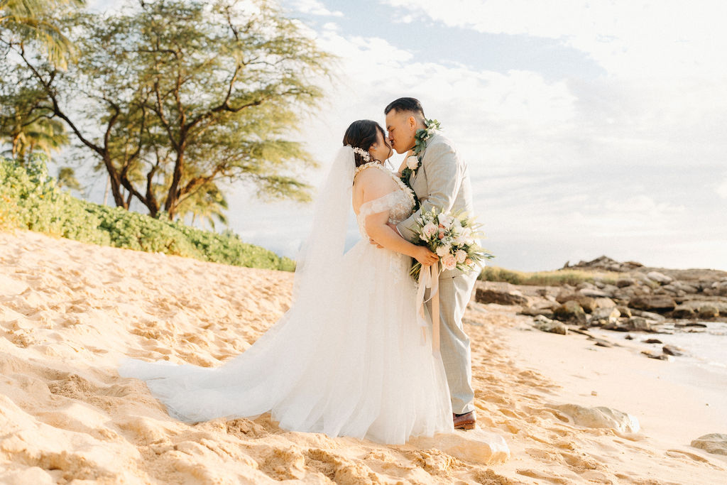 Bride and groom take wedding portraits at Lanikuhonua Cultural Institute