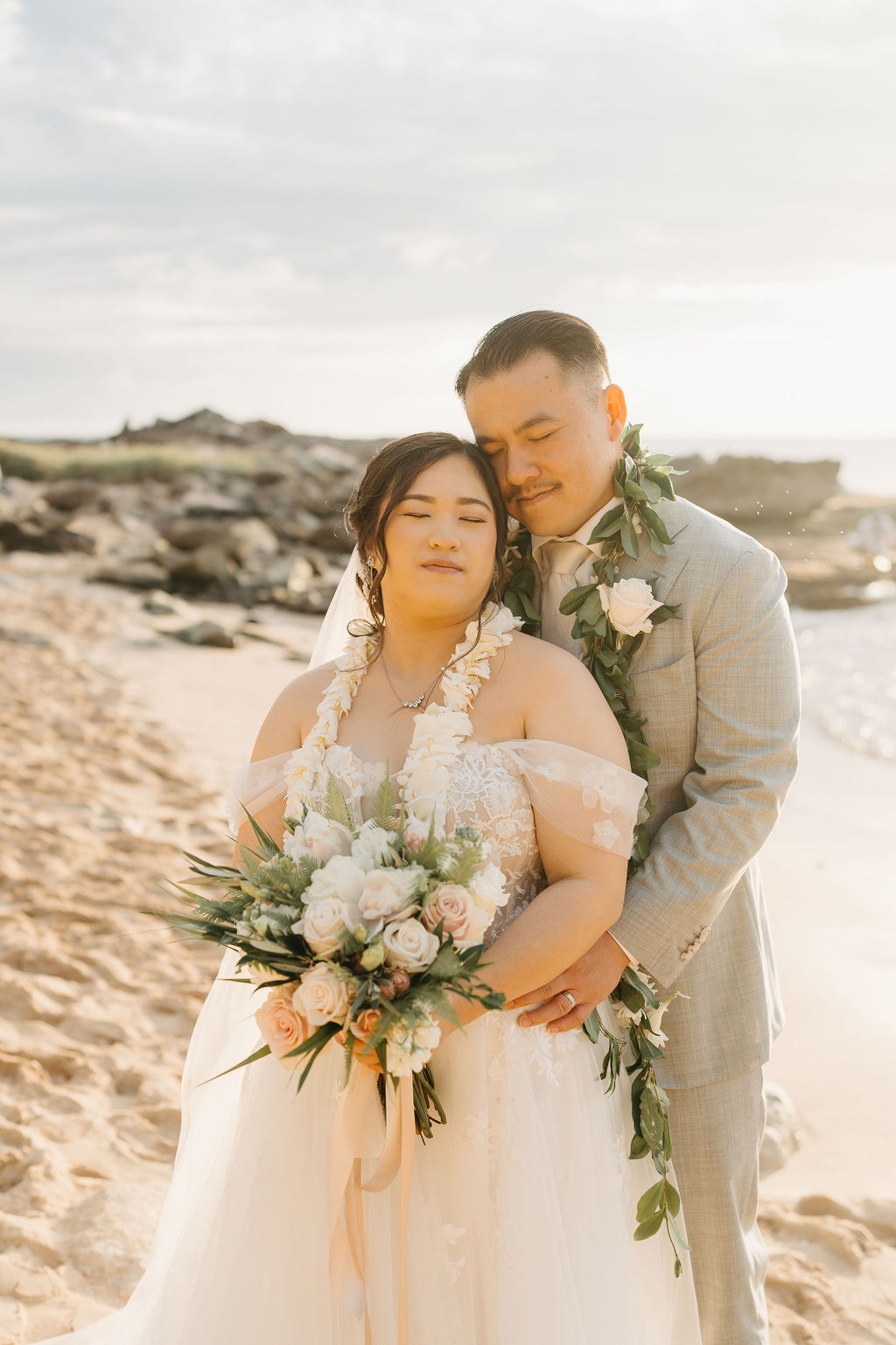 Bride and groom take wedding portraits at  Lanikuhonua Cultural Institute