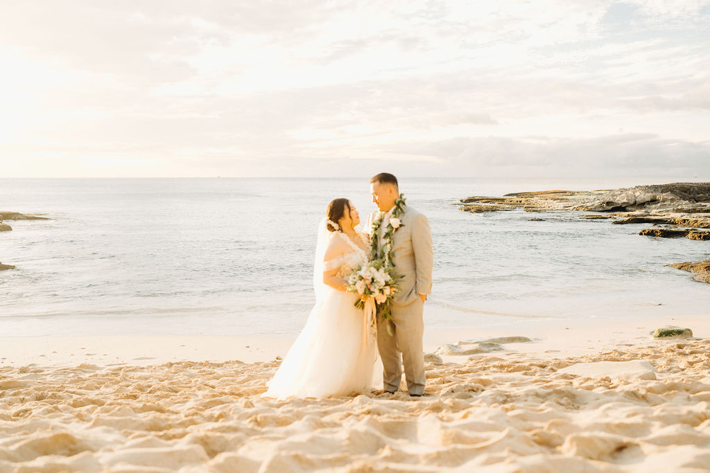 Bride and groom take wedding portraits at Lanikuhonua Cultural Institute