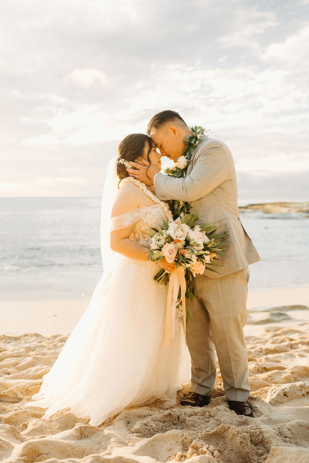 Bride and groom take wedding portraits at  Lanikuhonua Cultural Institute