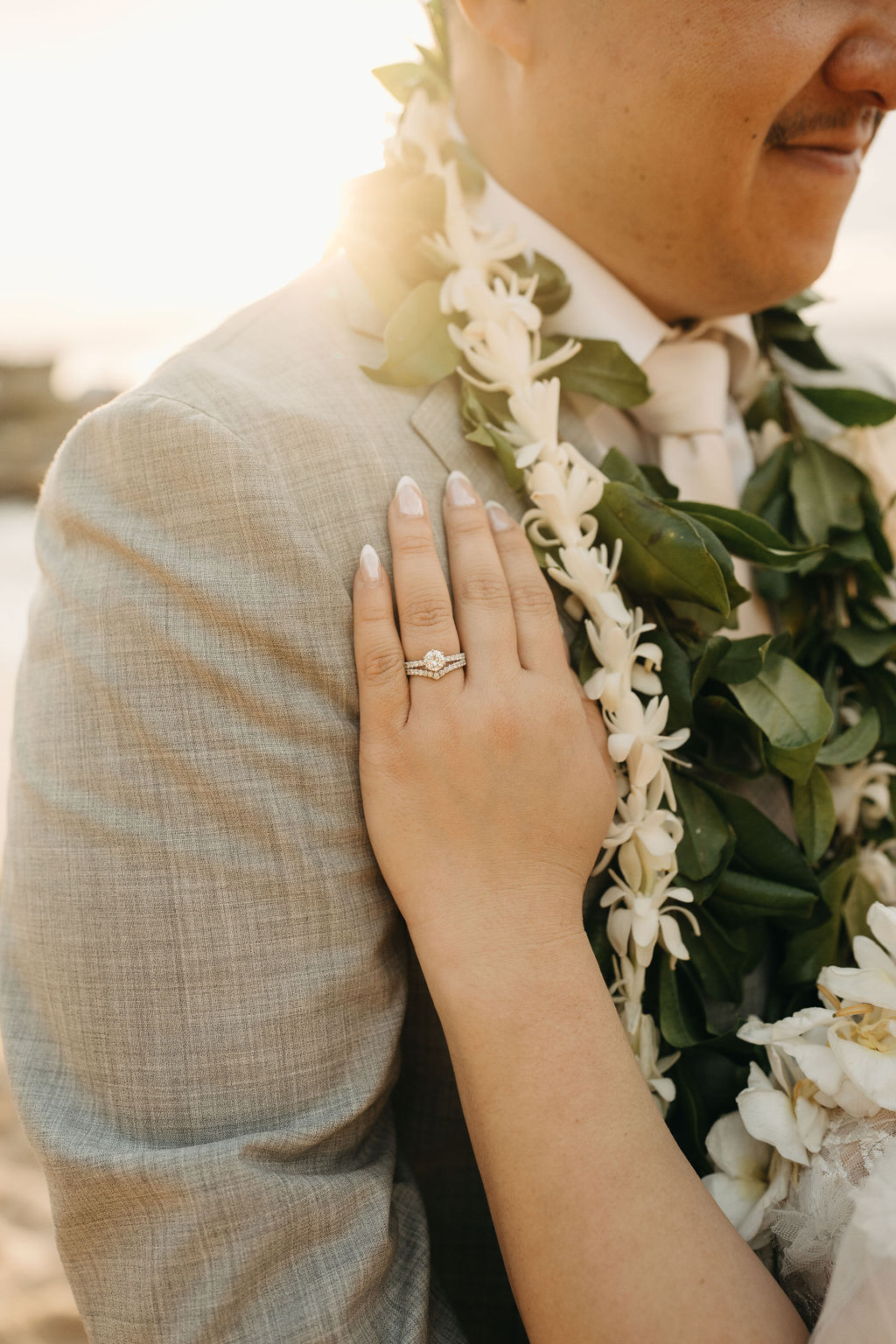 Bride and groom take wedding portraits at Lanikuhonua Cultural Institute