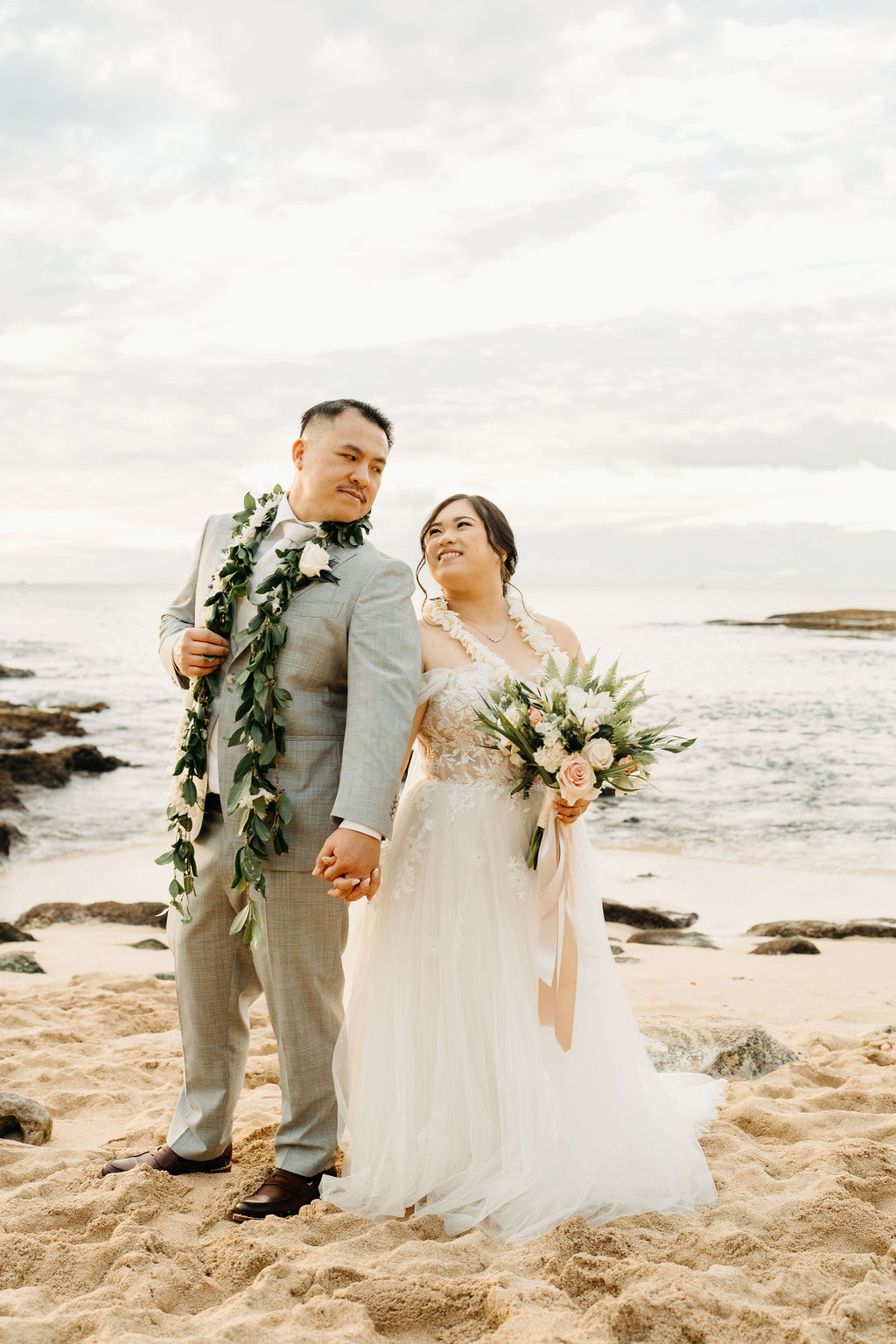 Bride and groom take wedding portraits at Lanikuhonua Cultural Institute