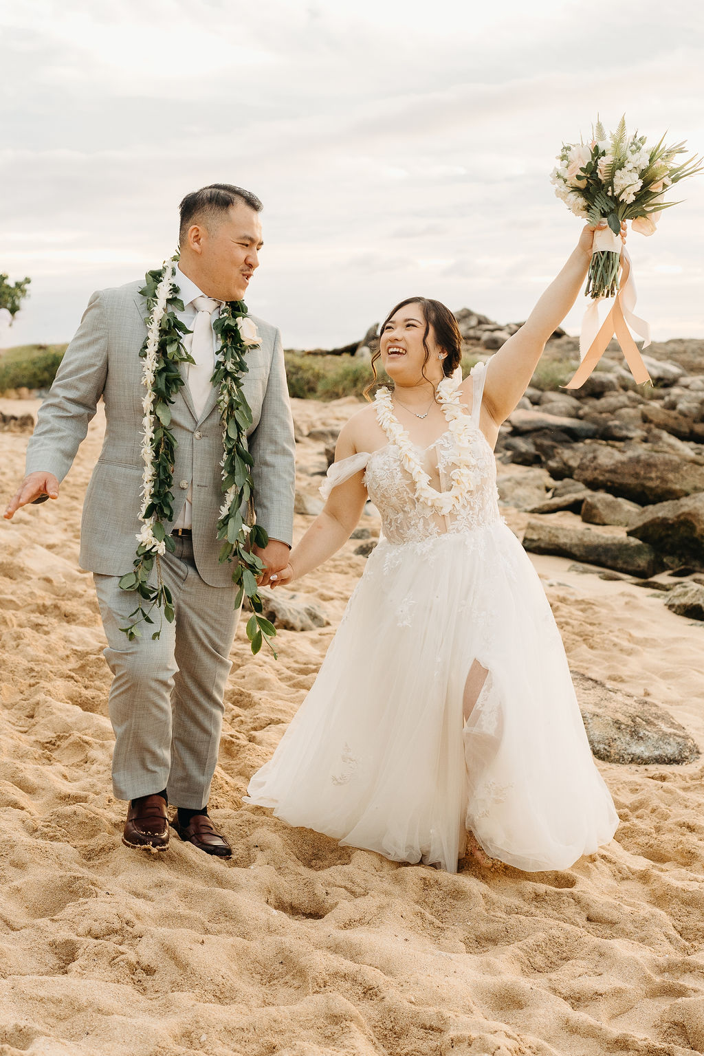 Bride and groom take wedding portraits at Lanikuhonua Cultural Institute