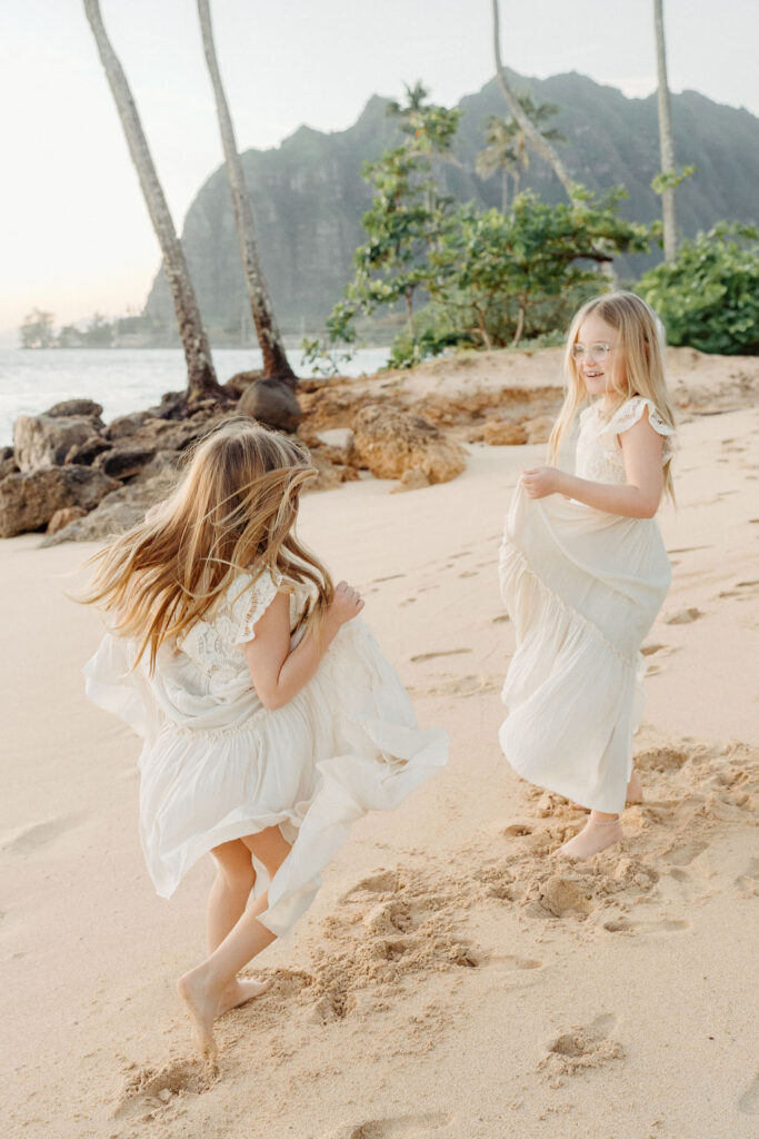 family taking family photos on their family vacation to Oahu