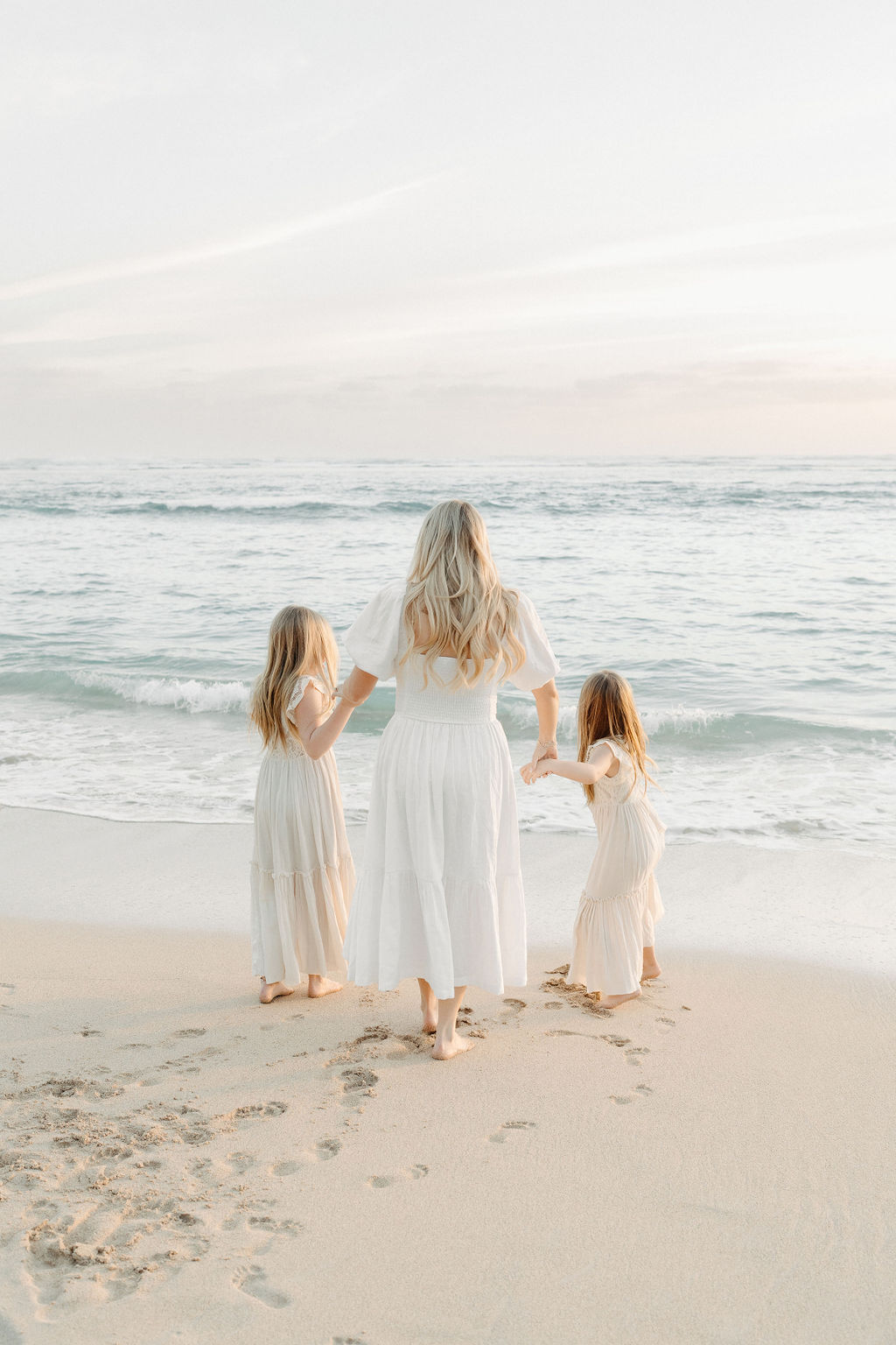 family taking family photos on their family vacation to Oahu