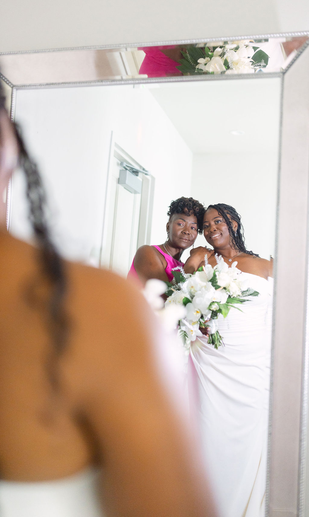 bride getting ready in a hotel room before her wedding in oahu hawaii