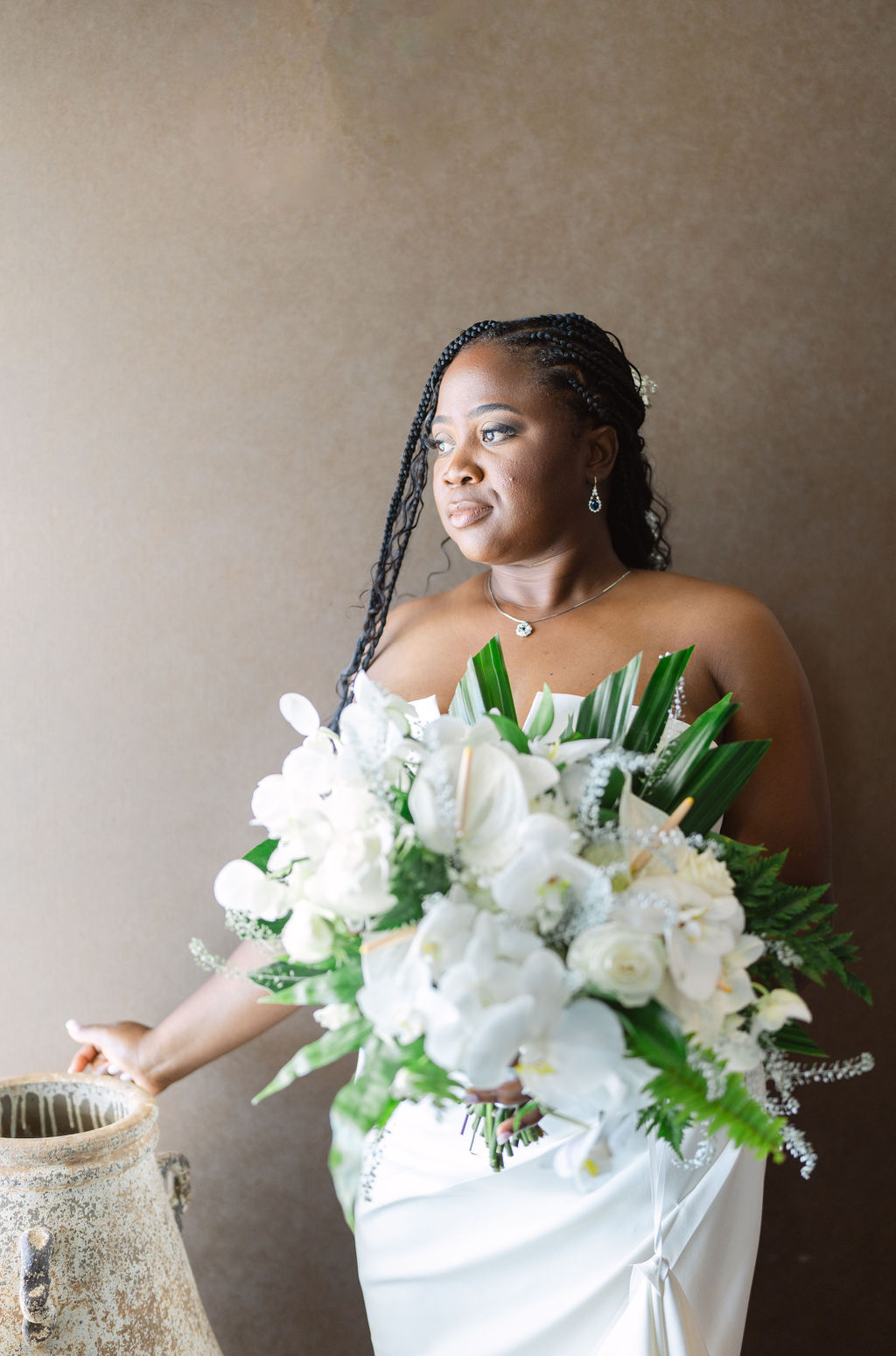 bride getting ready in a hotel room before her wedding in oahu hawaii