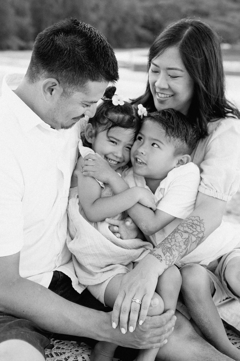 family takes fun photos on the beach for their oahu family portraits